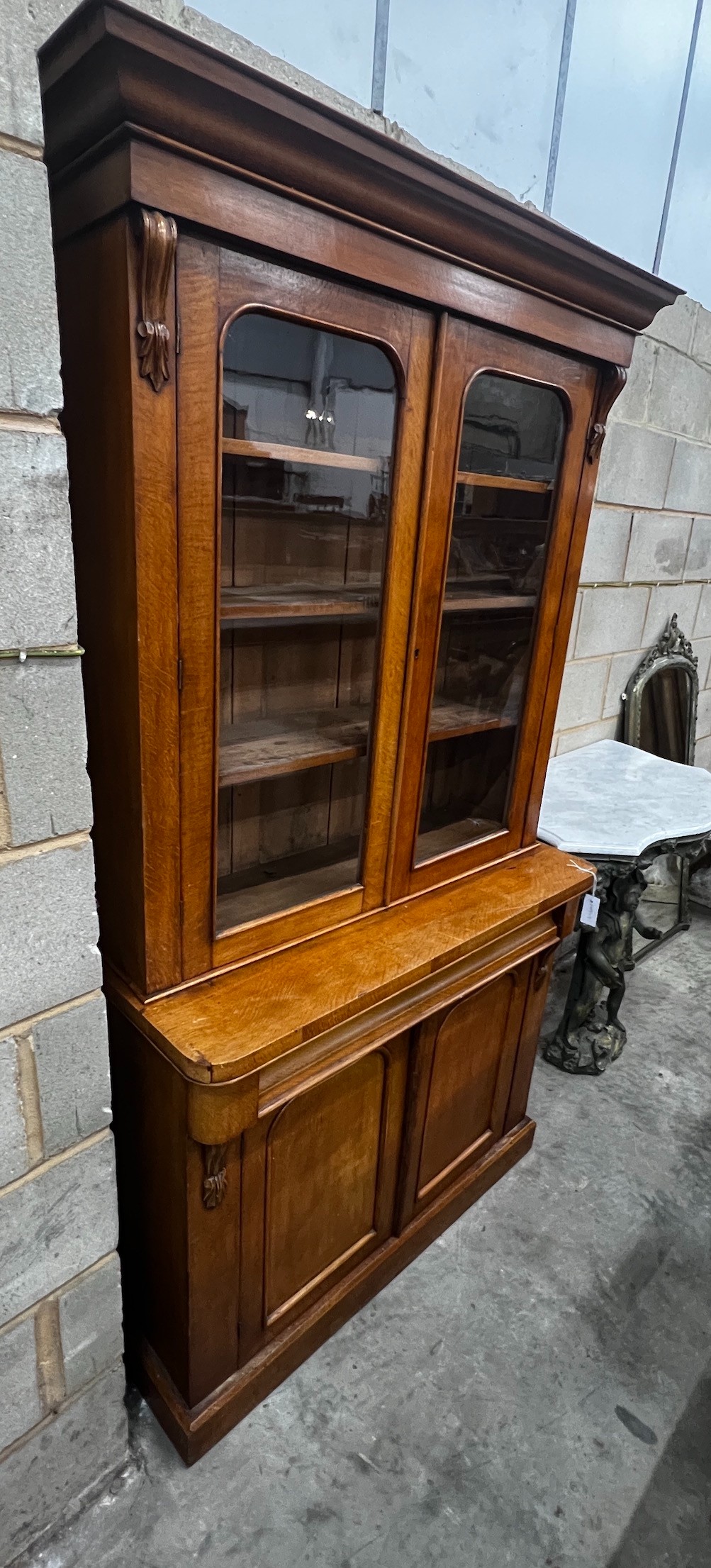 A Victorian oak bookcase cupboard, width 104cm, depth 42cm, height 200cm